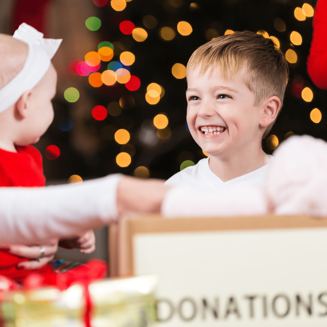 Kids giving out donations at christmas