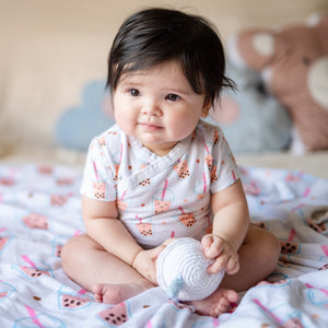 cute baby in the wee bean boba organic cotton onesie sitting