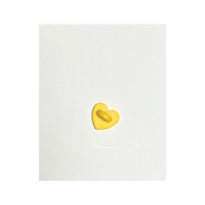 the wee bean egg tart pin with yellow
child safe soft rubber backing
