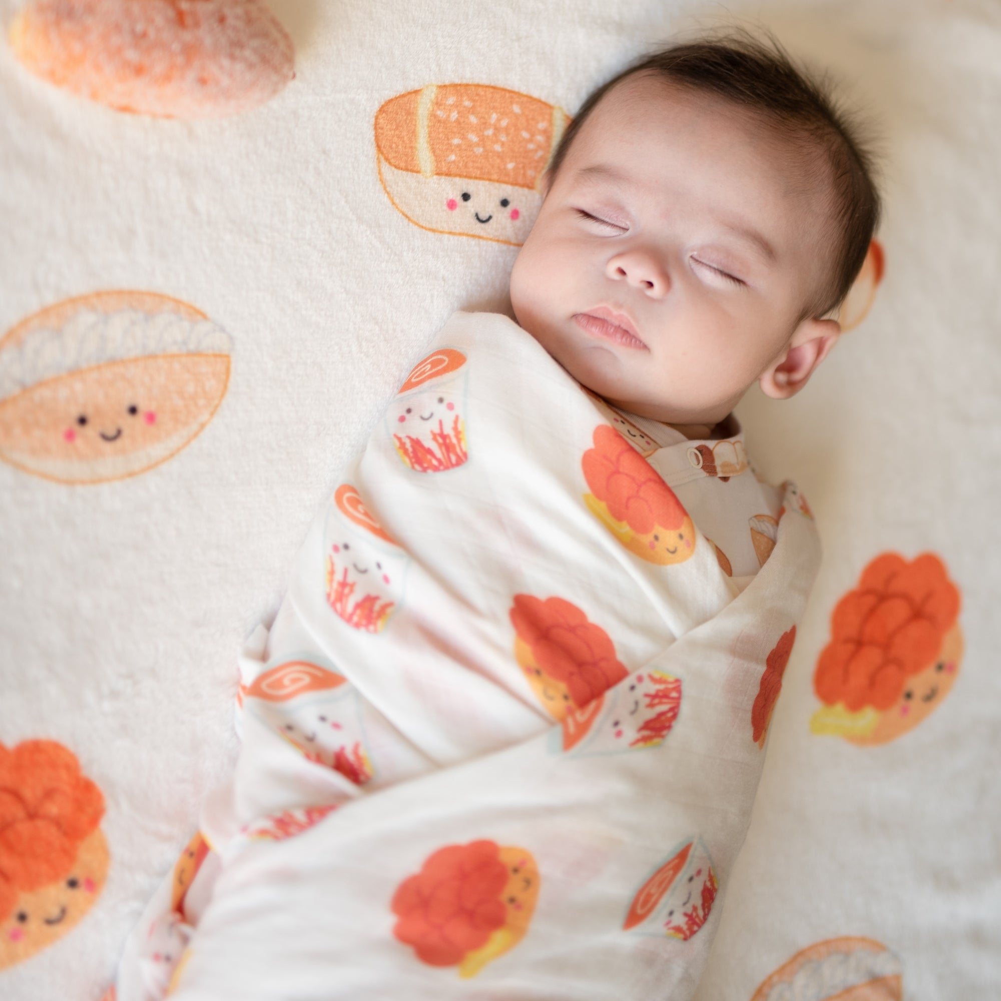 boy wrapped in the wee bean hong kong buns and milk tea swaddle