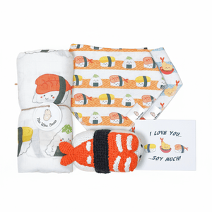 the wee bean organic baby essentials gift set in sushi with organic cotton bamboo swaddle, bib set and crochet rattle doll