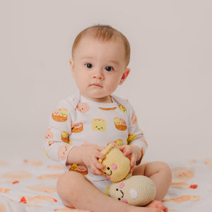 cute baby holding the wee bean crochet handmade rattle dolls