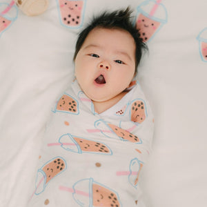 cute baby yawning swaddled in boba swaddle blanket