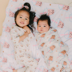 children laying on boba minky blanket