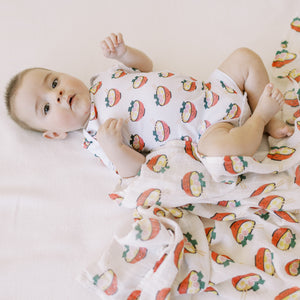 the wee bean organic cotton onesie in ramen and bamboo swaddle in ramen