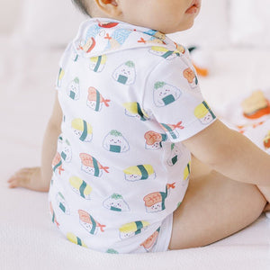 close up of the wee bean organic cotton onesie bodysuit romper in sushi