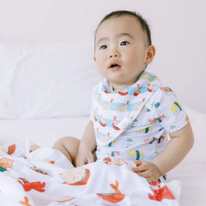 cute baby wearing the wee bean organic cotton baby bandana bibs in shrimp tempura from taste of japan collection
