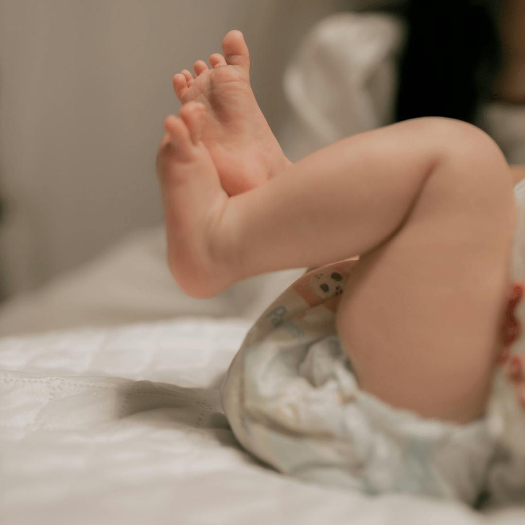 Baby holding its legs