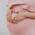 fingers on pregnant belly