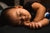 asian baby sleeping unswaddled