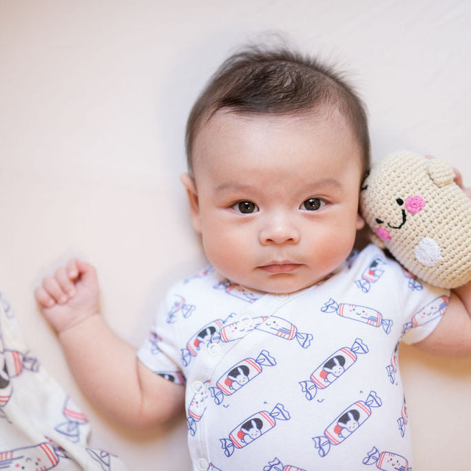 Baby wearing white rabbit candy organic onesie