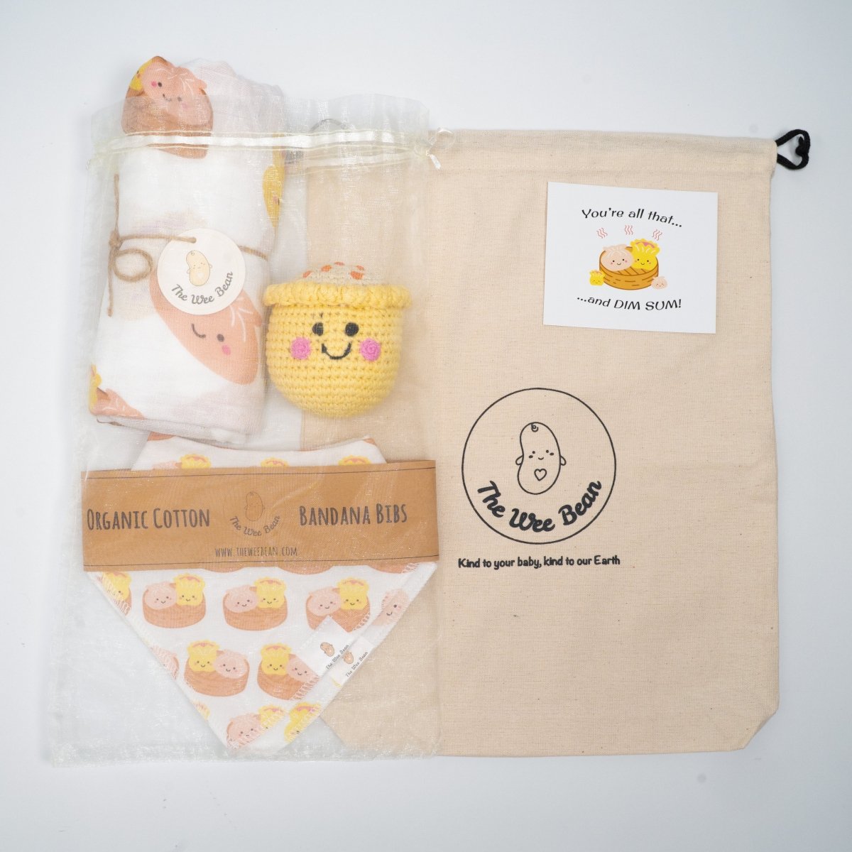 the wee bean organic and sustainable gifts in dim sum with swaddle, bib set and crochet rattle doll in siu mai