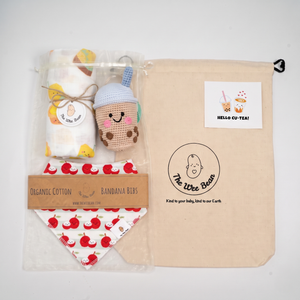 A baby gift set from The Wee Bean, featuring a cotton canvas drawstring bag and eco-friendly gift wrapping