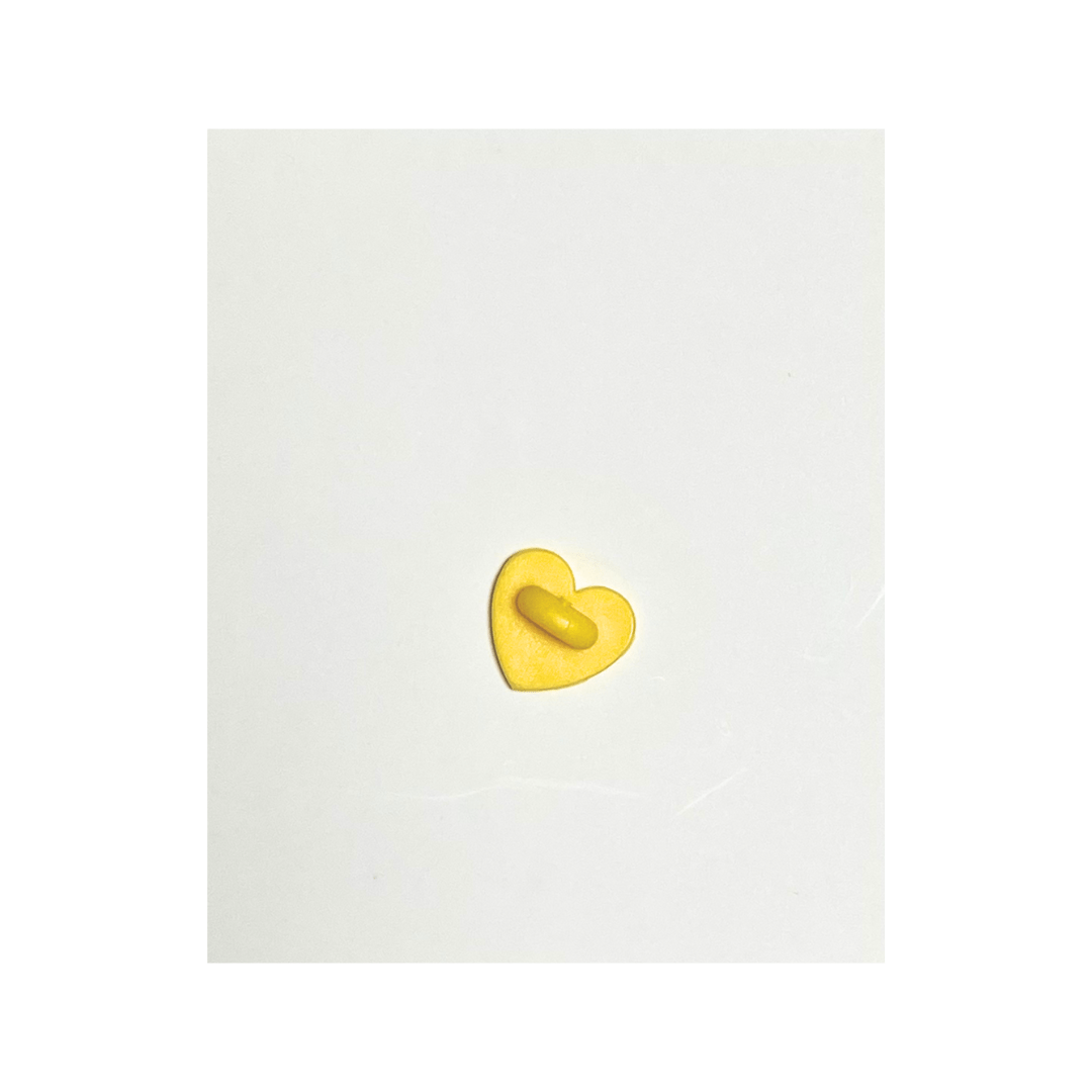the wee bean egg tart pin with yellow 
child safe soft rubber backing