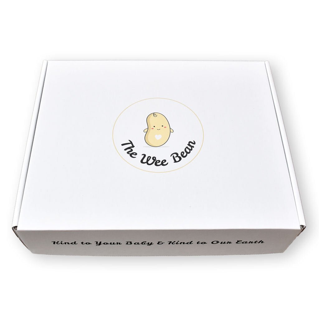 Packaged organic cotton bandana bibs with a plush toy and card, featuring sushi-themed designs.
