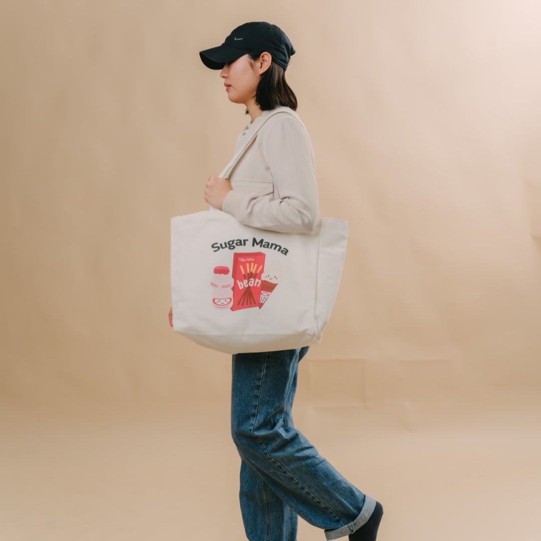 woman walking with the wee bean cotton canvas tote in sugar mama 