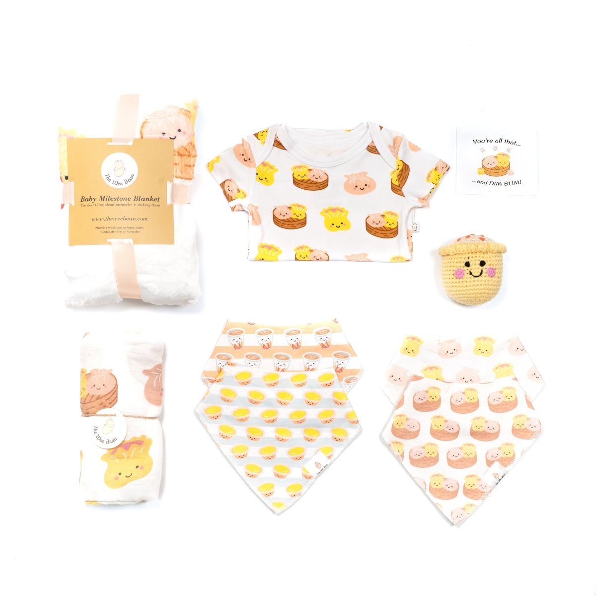 the wee bean organic and sustainable baby gift set with dim sum organic cotton onesie, swaddle, bib set, milestone blanket and crochet rattle doll