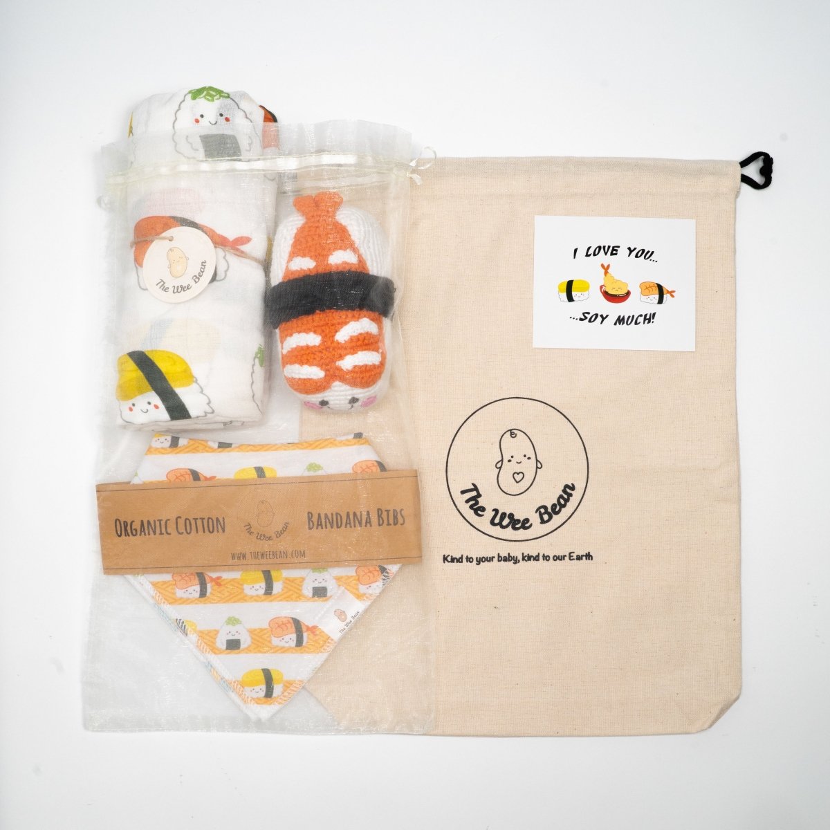 the wee bean organic baby essentials gift set in sushi with organic cotton bamboo swaddle, bib set and crochet rattle doll
