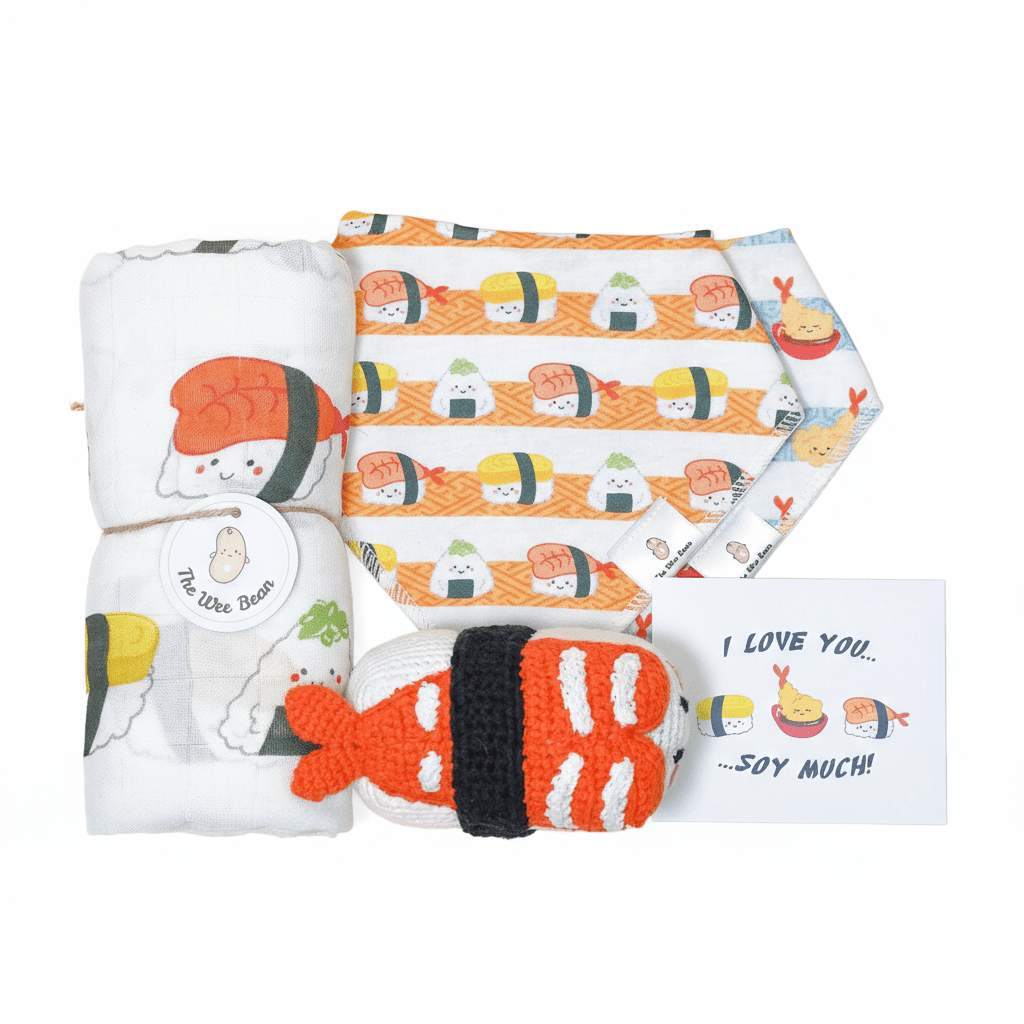 the wee bean organic baby essentials gift set in sushi with organic cotton bamboo swaddle, bib set and crochet rattle doll