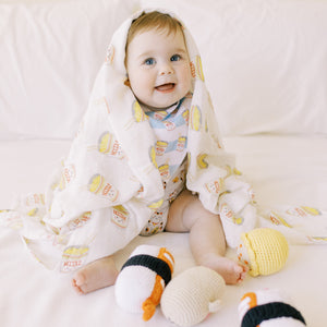 cute baby wearing the wee bean organic cotton bamboo swaddle in cup noodle