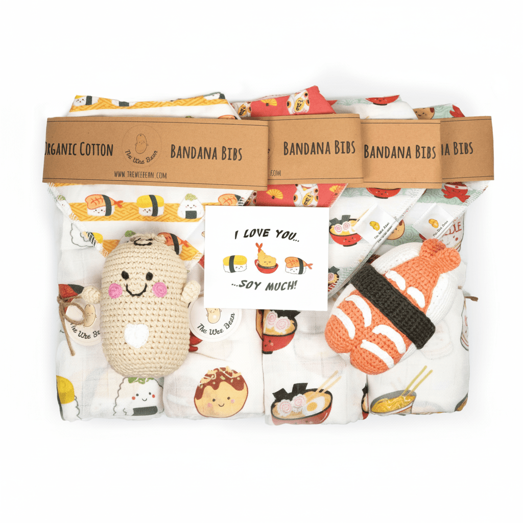 Packaged organic cotton bandana bibs with a plush toy and card, featuring sushi-themed designs.