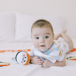 baby tummy time playing with the wee bean sushi doll