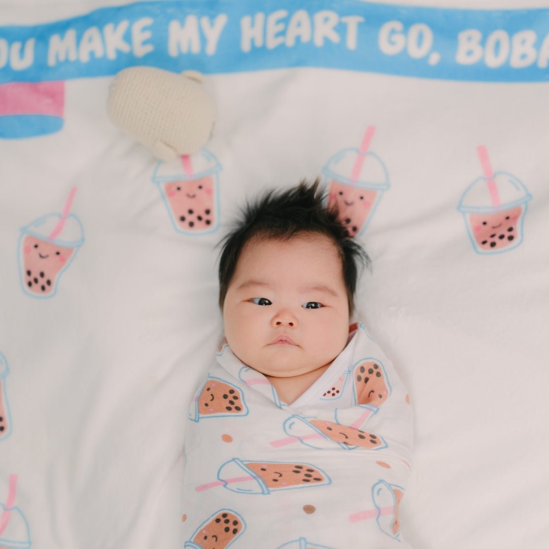Boba Collection of baby products including a blanket, t-shirt, bib, and toys gift set