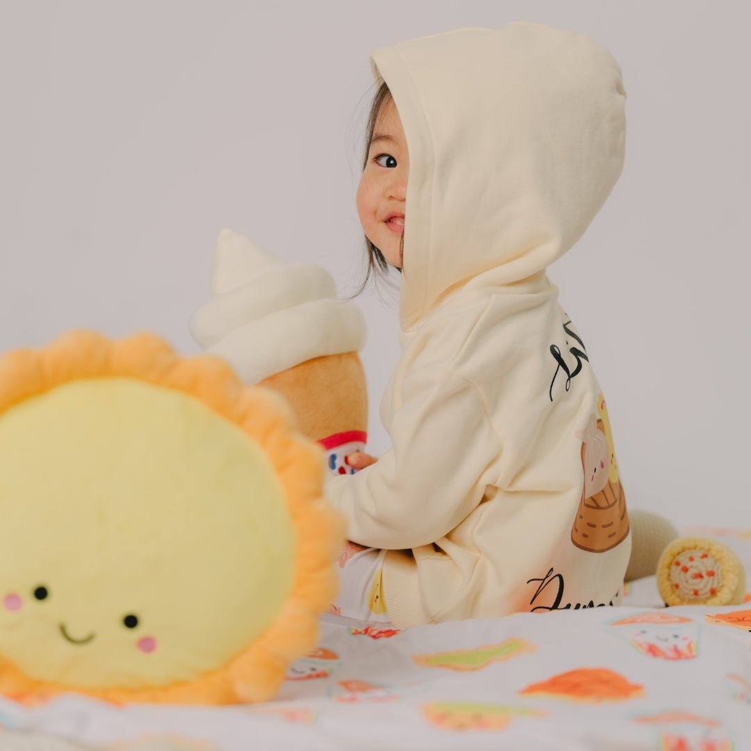 cute girl in the wee bean organic hoodie in dim sum with egg tart plushie