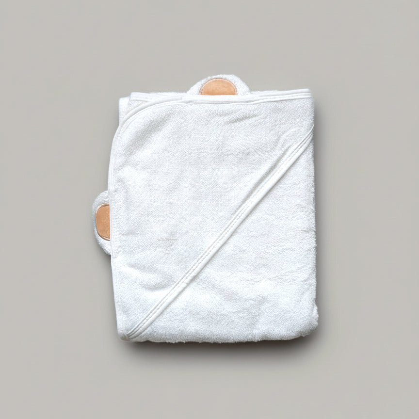 Folded white hooded bamboo baby kids towel with brown bear ears