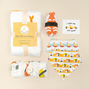 the wee bean organic and sustainable baby gift set with blankets bibs swaddle and rattle doll in taste of japan sushi tempura