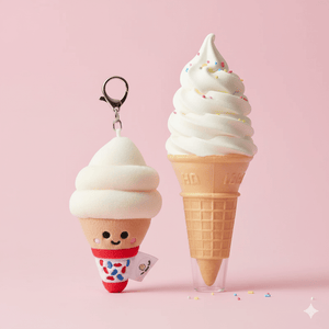 Ice cream cone plush toy with a keychain and another ice cream cone on a pink background