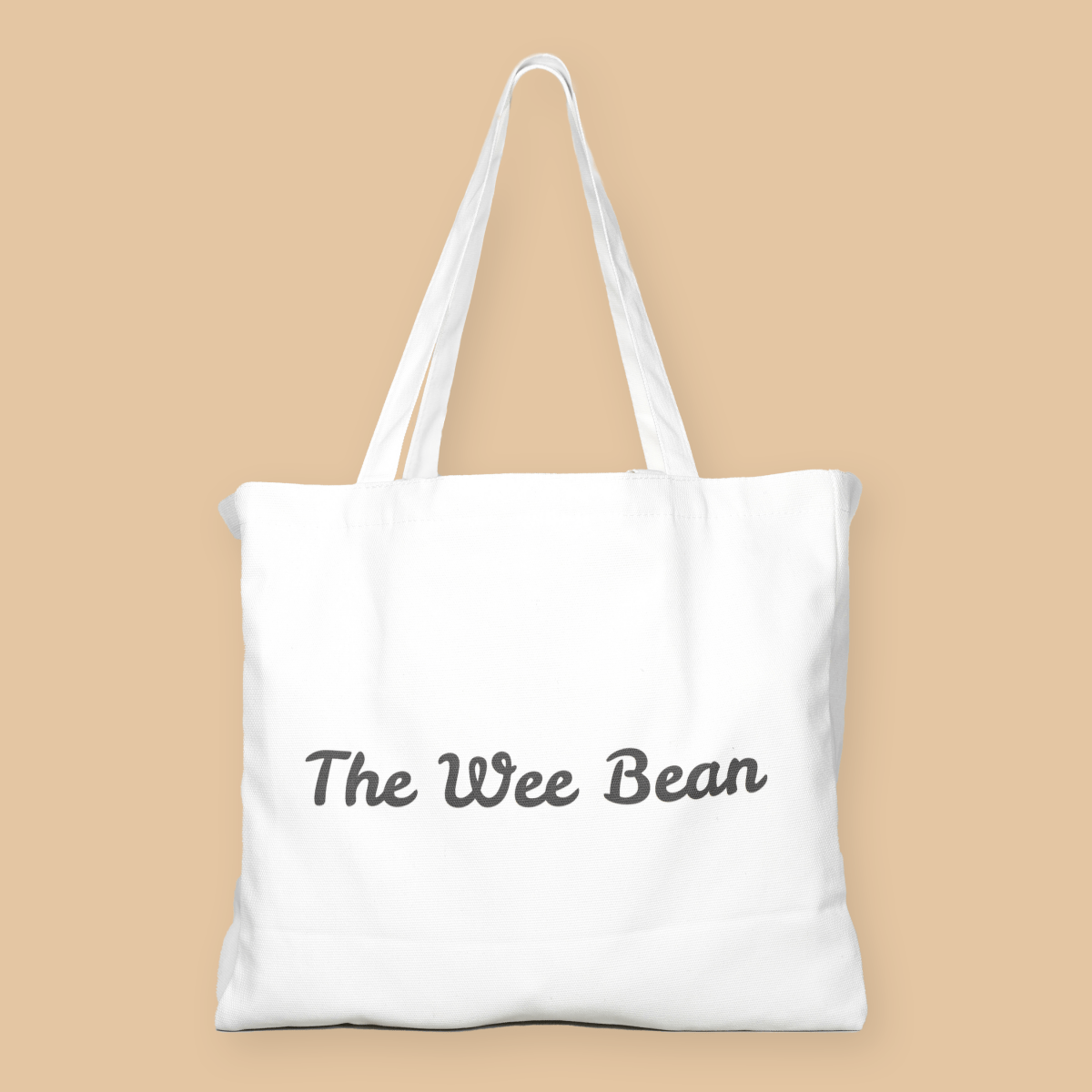 White tote bag with a colorful graphic of a cityscape and cartoon characters on a beige background
