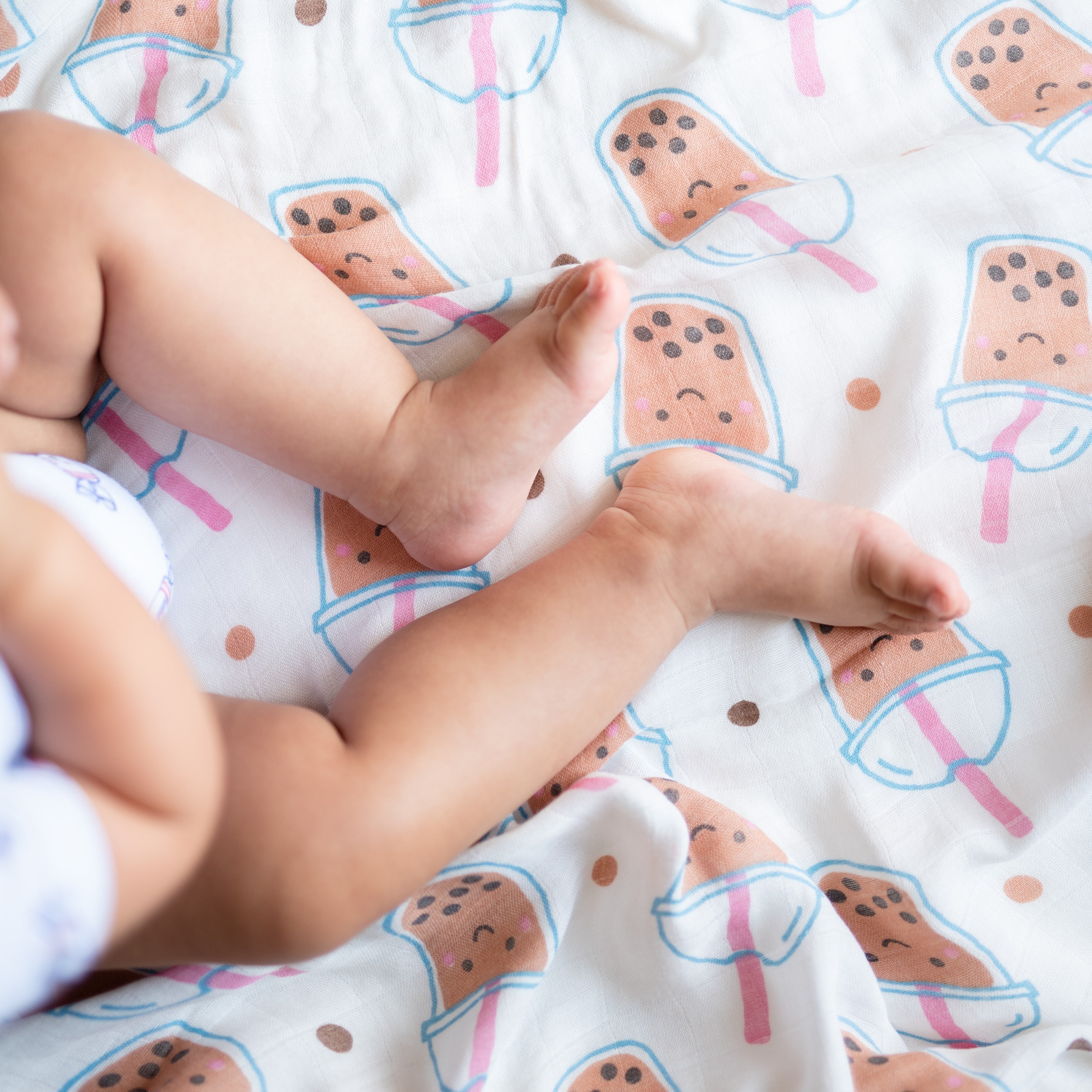cute baby feet on  the wee bean organic cotton and bamboo swaddle in boba bubble tea