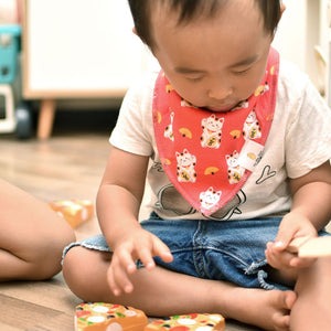 cute baby wearing the wee bean organic cotton baby bandana bibs in white fortune lucky cat from taste of japan collection