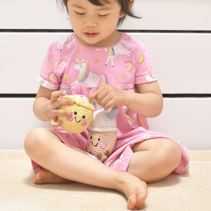 child playing with the wee bean fair-trade rattle dolls in boba and siu mai