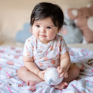 cute baby wearing the wee bean super soft organic cotton onesie bodysuit romper in boba bubble tea