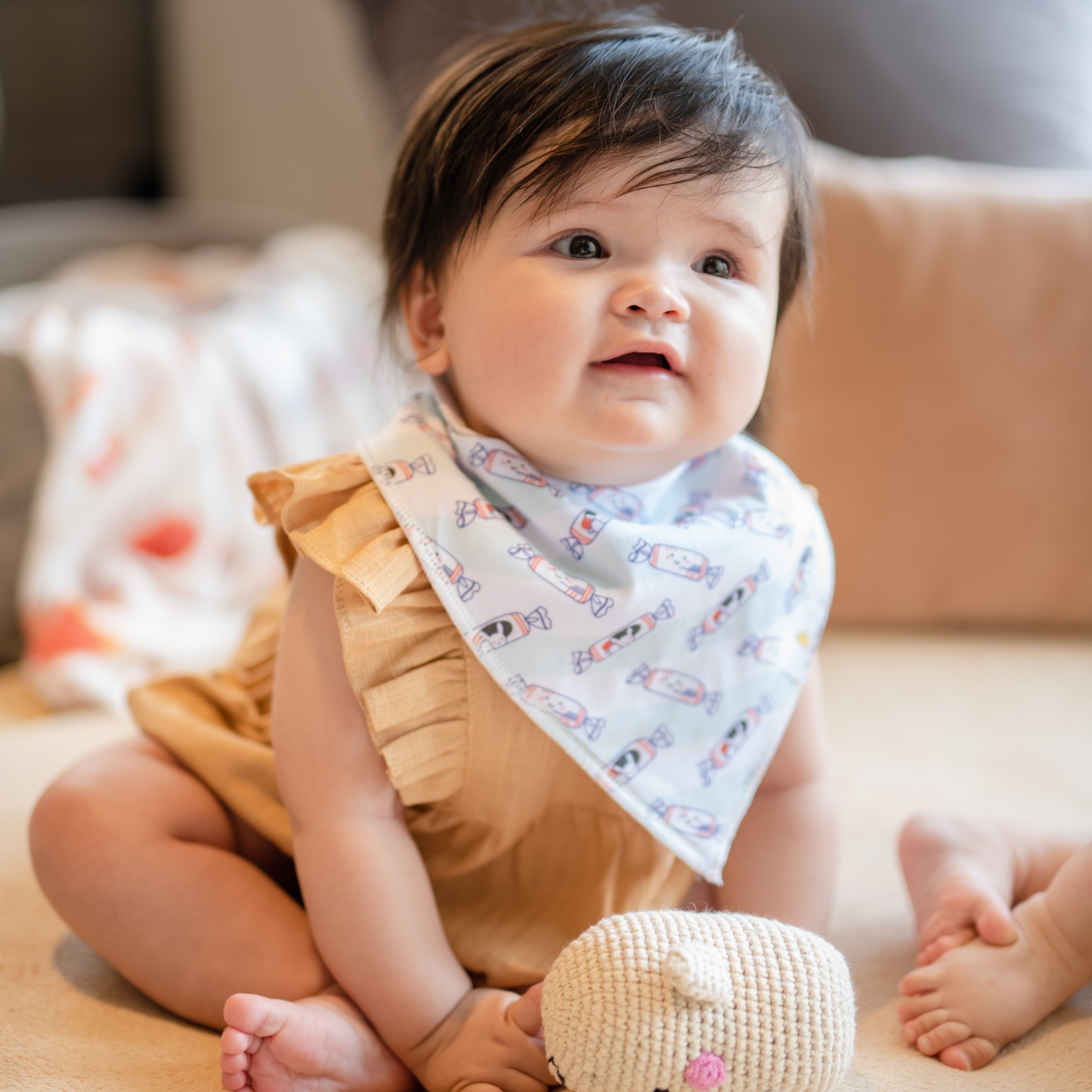 cute baby wearing the wee bean organic cotton bandana bib in white rabbit candy