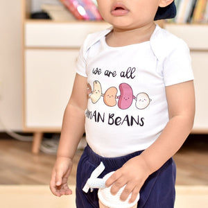 baby belly in the wee bean organic cotton onesie in we are all human beans anti-hate anti-violence charity
