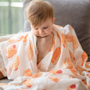 Cute baby in the wee bean organic cotton bamboo swaddle extra large super soft bakery buns