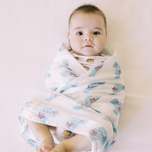 the wee bean organic cotton swaddle in japanese sake wrapped around baby