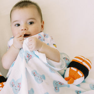 cute baby wrapped in organic cotton and bamboo swaddle in sake