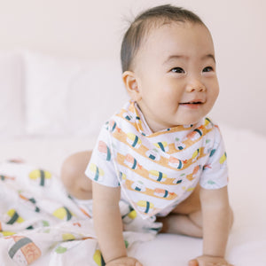 cute baby wearing the wee bean organic cotton bandana bib in sushi