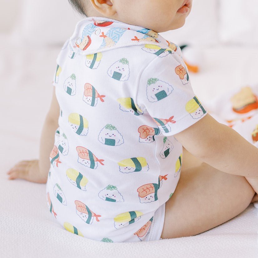 close up of the wee bean organic cotton onesie bodysuit romper in sushi 