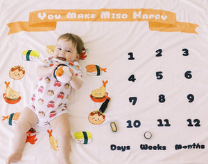 cute baby on the wee bean super soft fleece milestone blanket in you make miso happy