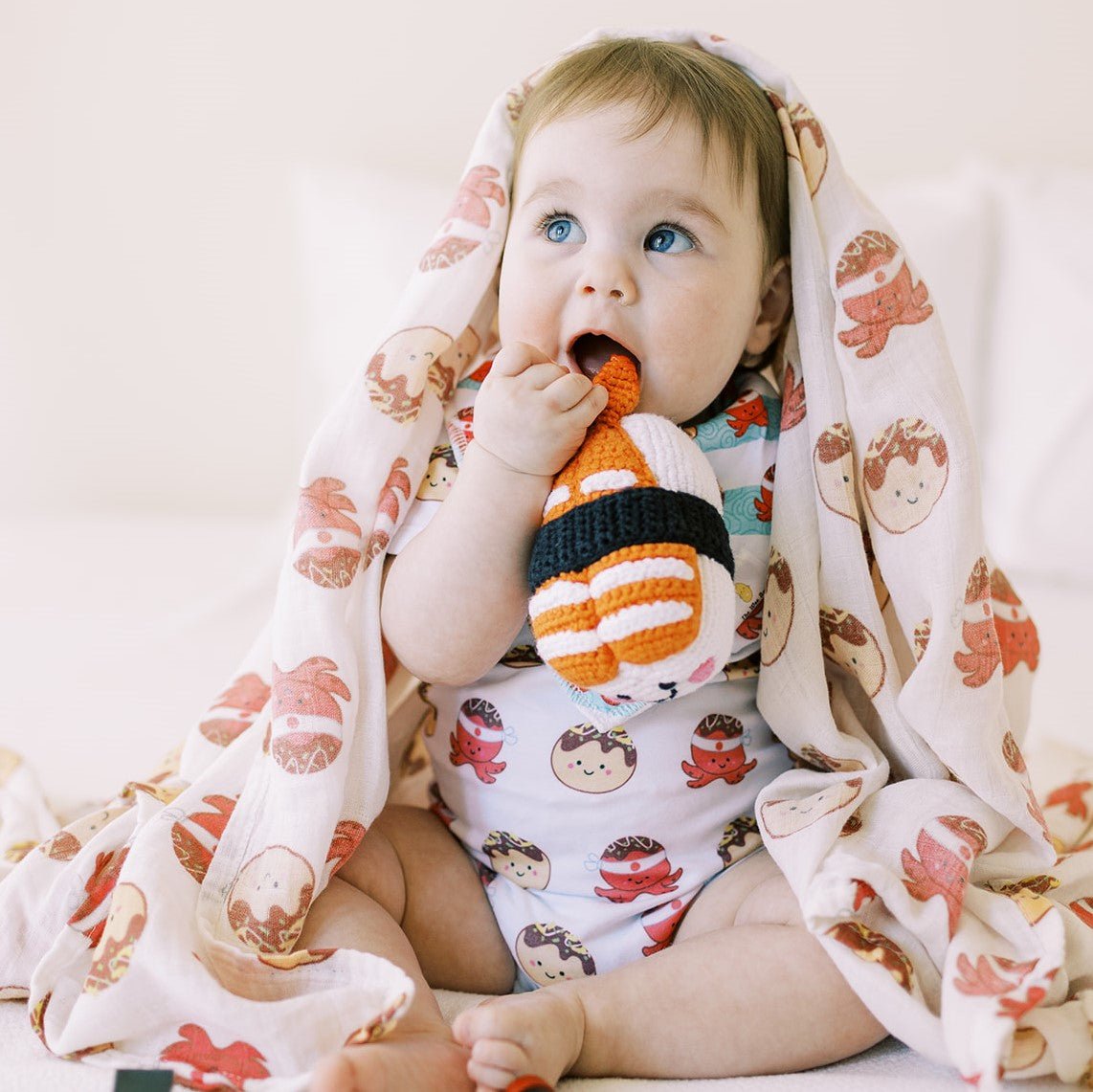 the wee bean organic baby swaddle bib and onesie in takoyaki 