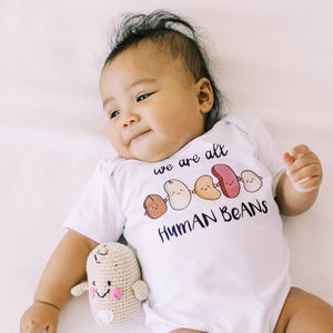 the wee bean organic cotton baby onesie bodysuit in we are all human bean