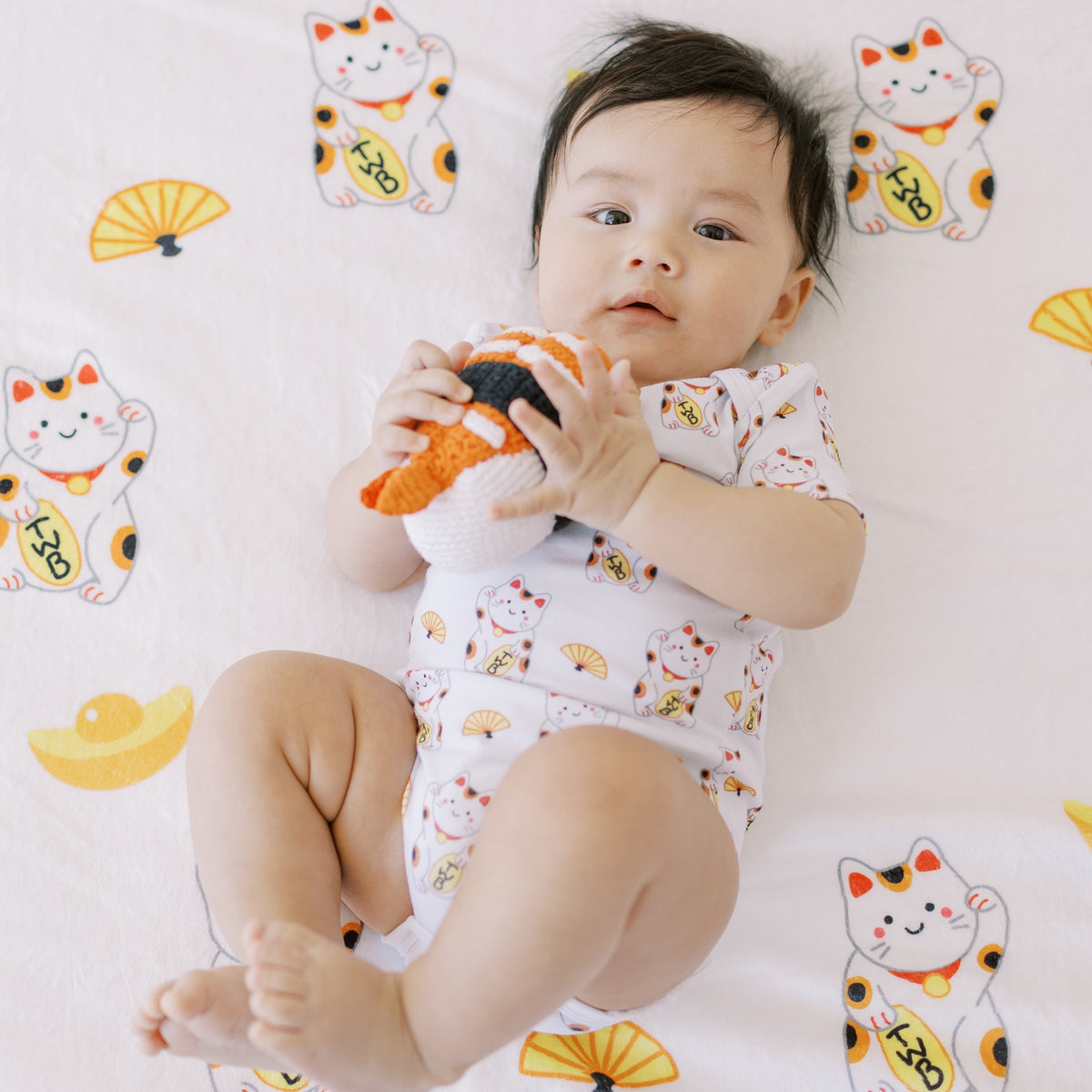 cute baby on the wee bean milestone blanket in japan lucky cat