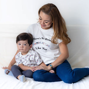 the wee bean mommy and me matching white rabbit candy bunny candy tees sitting on bed